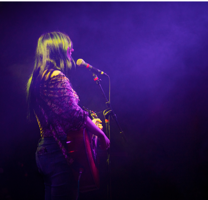 WOMAN ON GUITAR